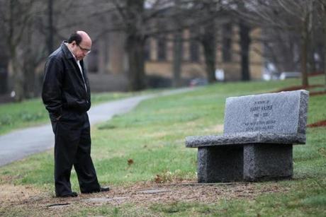 Jim Kasper at a bench memorializing his son at Andover Newton Theological School near his home.  
